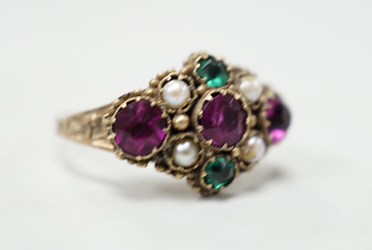 An early 20th century 9ct and coloured paste set ring, in the Suffragette colours, size N, gross weight 2.3 grams.
